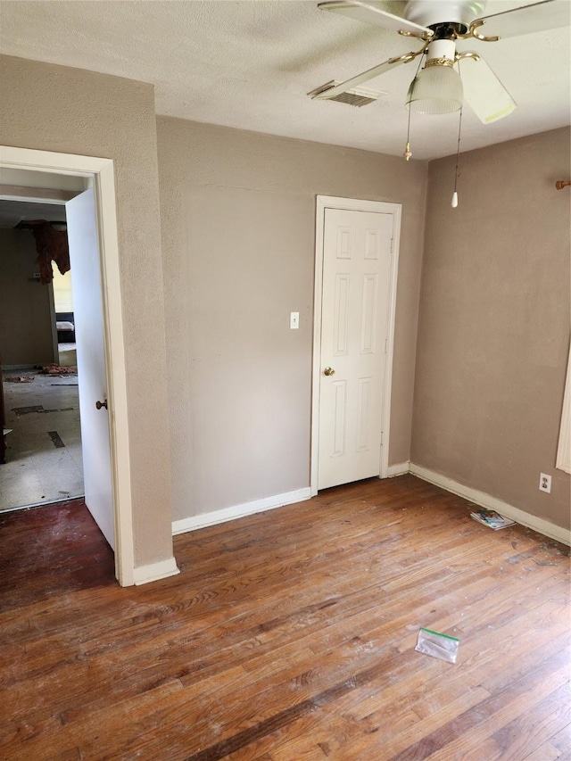 4802 Hain St, Houston, TX 77009 - unfurnished room featuring a ceiling fan and wood finished floors