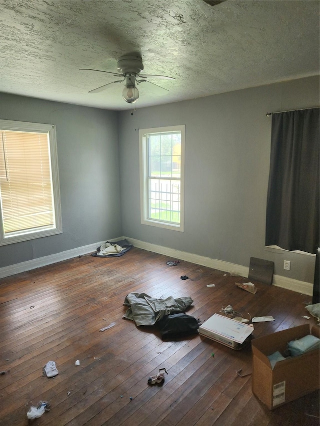 4802 Hain St, Houston, TX 77009 - empty room with a ceiling fan, wood-type flooring, and a textured ceiling