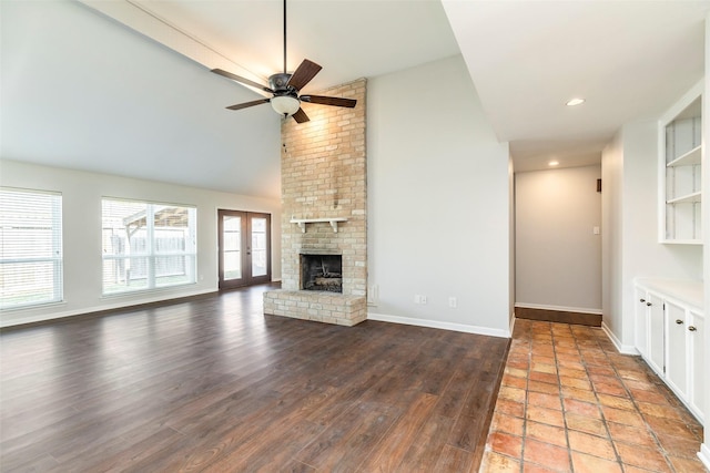 11822 Poplar Creek Dr, Houston, TX 77077 - unfurnished living room featuring ceiling fan, a fireplace, wood finished floors, and high vaulted ceiling