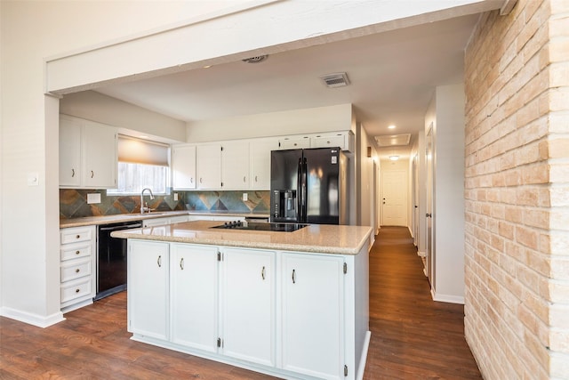 11822 Poplar Creek Dr, Houston, TX 77077 - kitchen with black appliances, a center island, dark wood finished floors, and white cabinets