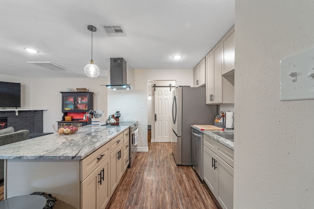 16230 Bowie Ridge Ln, Houston, TX 77053 - kitchen with wall chimney exhaust hood, appliances with stainless steel finishes, dark wood-style floors, a peninsula, and open floor plan