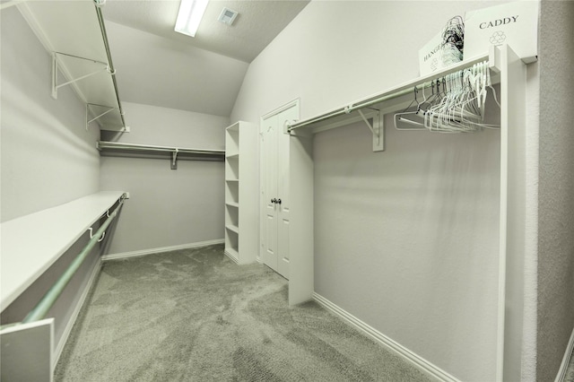 634 Oak Ridge Grove Cir, Spring, TX 77386 - spacious closet with carpet flooring and vaulted ceiling