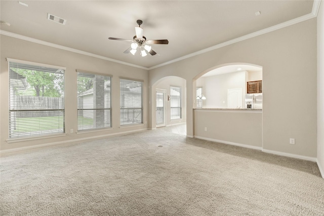 634 Oak Ridge Grove Cir, Spring, TX 77386 - unfurnished living room featuring ceiling fan, healthy amount of natural light, crown molding, and light carpet