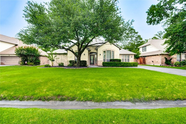 634 Oak Ridge Grove Cir, Spring, TX 77386 - french provincial home with a front lawn