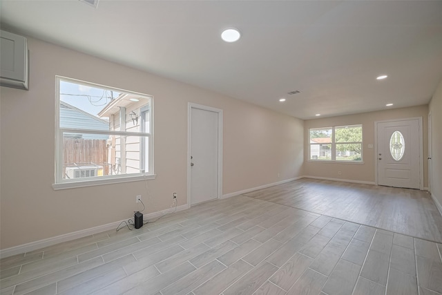 11311 Raincove Dr, Houston, TX 77016 - foyer entrance featuring light wood-type flooring and recessed lighting