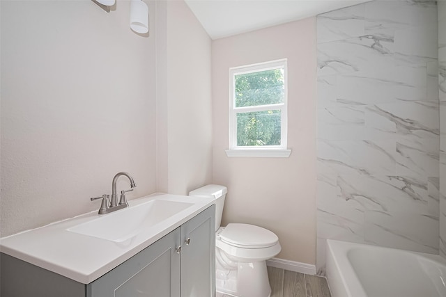 11311 Raincove Dr, Houston, TX 77016 - bathroom featuring vanity, wood finished floors, and shower / tub combination