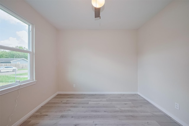 11311 Raincove Dr, Houston, TX 77016 - empty room with light wood finished floors and ceiling fan