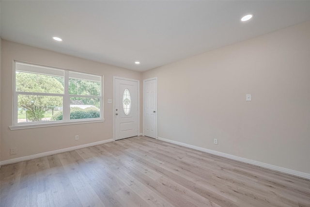 11311 Raincove Dr, Houston, TX 77016 - entryway featuring light wood finished floors and recessed lighting