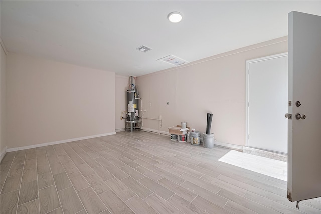11311 Raincove Dr, Houston, TX 77016 - unfurnished room featuring water heater and light wood-style flooring