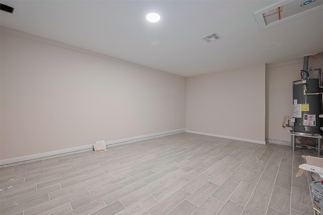 11311 Raincove Dr, Houston, TX 77016 - interior space featuring water heater and light wood finished floors