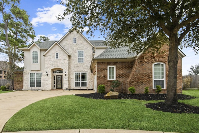 18806 Manleigh Ct, Tomball, TX 77377 - view of front of property featuring roof with shingles and stone siding
