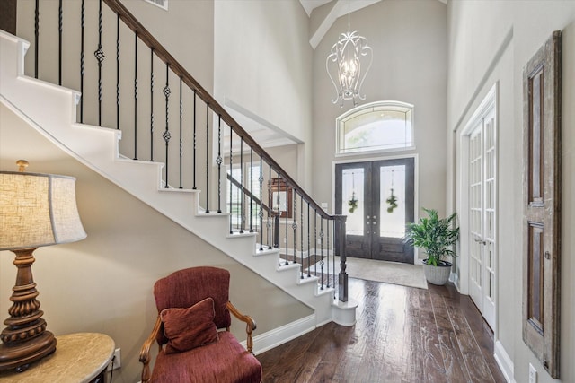 28114 Bayou Cove Ct, Fulshear, TX 77441 - foyer with a towering ceiling, stairs, french doors, wood finished floors, and a chandelier