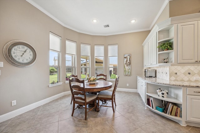 28114 Bayou Cove Ct, Fulshear, TX 77441 - dining area featuring crown molding, light tile patterned flooring, and recessed lighting