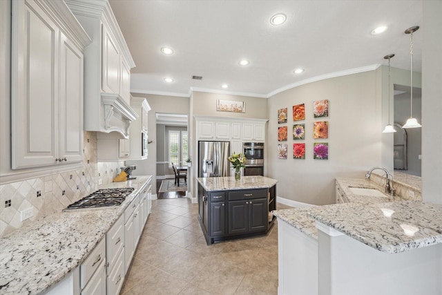 28114 Bayou Cove Ct, Fulshear, TX 77441 - kitchen with appliances with stainless steel finishes, backsplash, recessed lighting, light stone countertops, and white cabinetry
