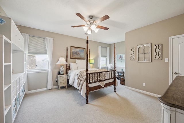 28114 Bayou Cove Ct, Fulshear, TX 77441 - bedroom with multiple windows, light colored carpet, and a ceiling fan