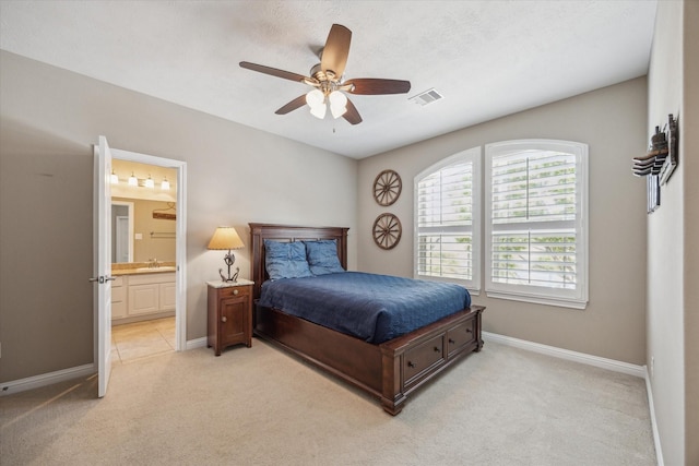 28114 Bayou Cove Ct, Fulshear, TX 77441 - bedroom featuring light carpet, ensuite bathroom, and ceiling fan
