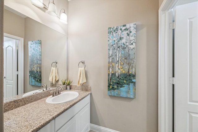 28114 Bayou Cove Ct, Fulshear, TX 77441 - bathroom with vanity and baseboards