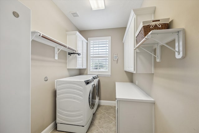 28114 Bayou Cove Ct, Fulshear, TX 77441 - washroom featuring cabinet space, washing machine and dryer, and light tile patterned floors