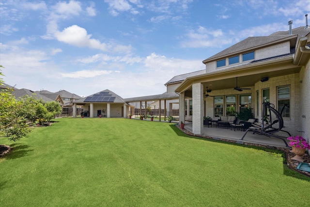 28114 Bayou Cove Ct, Fulshear, TX 77441 - fenced backyard featuring ceiling fan, a patio area, and an outdoor living space