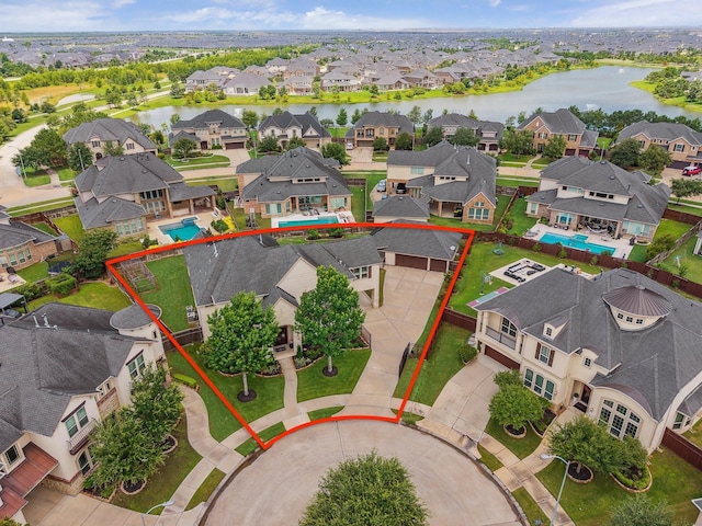 28114 Bayou Cove Ct, Fulshear, TX 77441 - aerial view of residential area featuring a large body of water and property parcel outlined