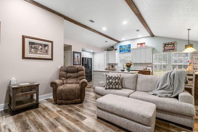 137 County Road 3665, Splendora, TX 77372 - living room featuring wood finished floors and recessed lighting