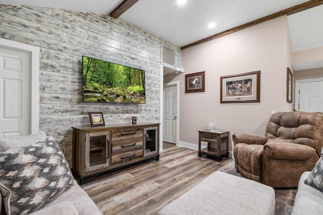 137 County Road 3665, Splendora, TX 77372 - living room with wooden walls, light wood-type flooring, an accent wall, beam ceiling, and recessed lighting