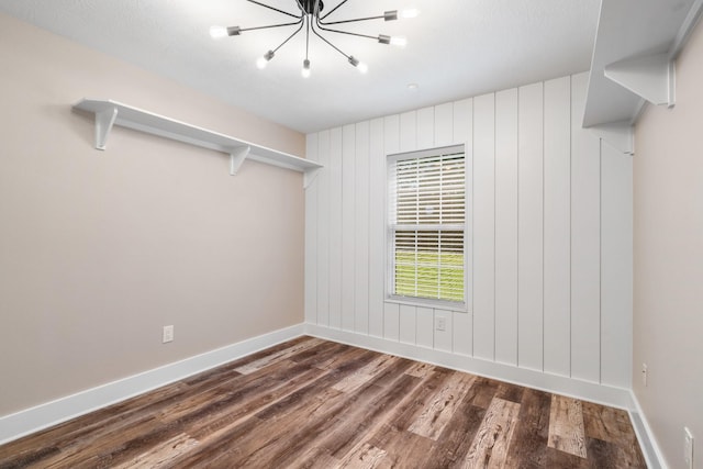 137 County Road 3665, Splendora, TX 77372 - unfurnished room featuring a chandelier and wood finished floors