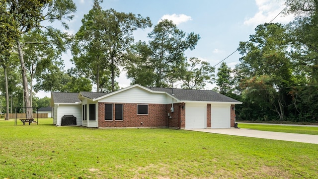 137 County Road 3665, Splendora, TX 77372 - view of front facade with a garage, concrete driveway, brick siding, and a front lawn