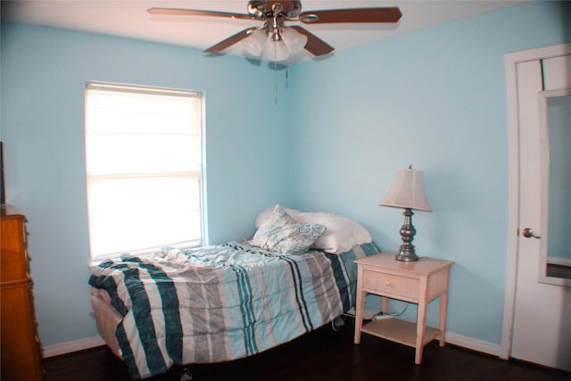 329 Robin St, Deer Park, TX 77536 - bedroom with multiple windows, dark wood finished floors, and a ceiling fan