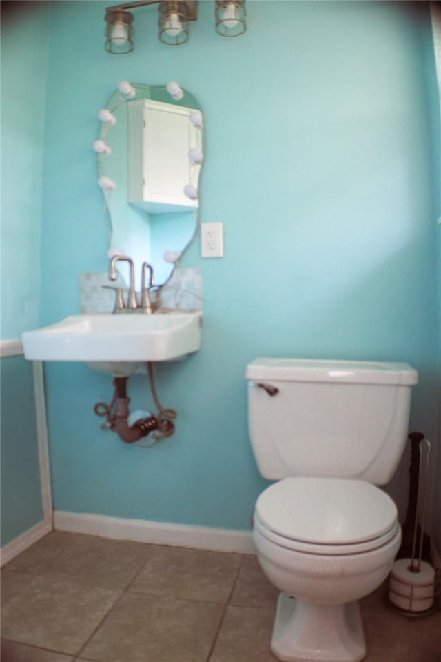 329 Robin St, Deer Park, TX 77536 - half bathroom featuring tile patterned flooring and toilet