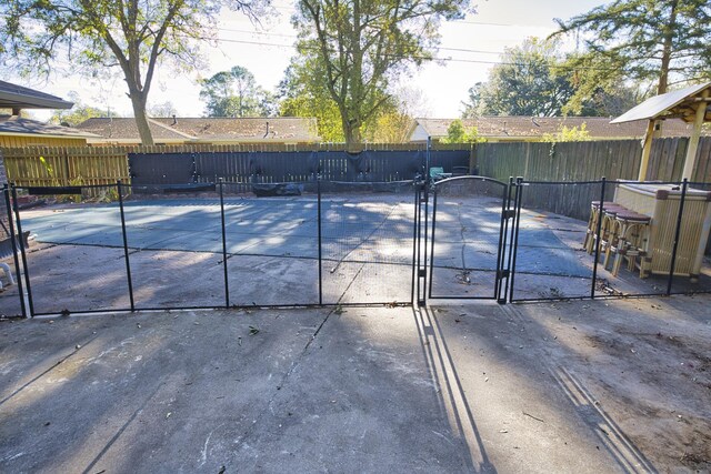 1303 Mac Dr, Sweeny, TX 77480 - view of swimming pool with a gate