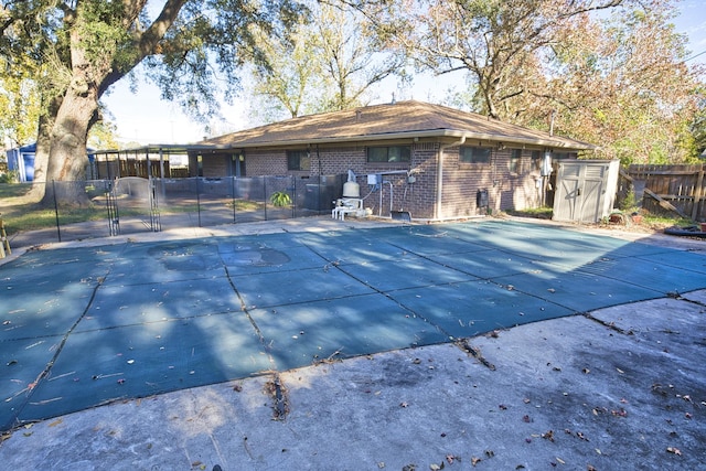 1303 Mac Dr, Sweeny, TX 77480 - view of swimming pool featuring a gate