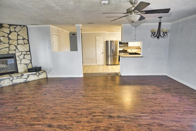 1303 Mac Dr, Sweeny, TX 77480 - unfurnished living room with ornamental molding, light wood-style flooring, a ceiling fan, a fireplace, and a chandelier