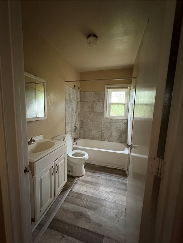 1206 11th St N, Texas City, TX 77590 - bathroom featuring vanity, shower / washtub combination, and wood finished floors