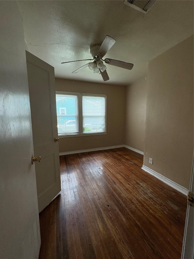 1206 11th St N, Texas City, TX 77590 - spare room with ceiling fan and hardwood / wood-style flooring