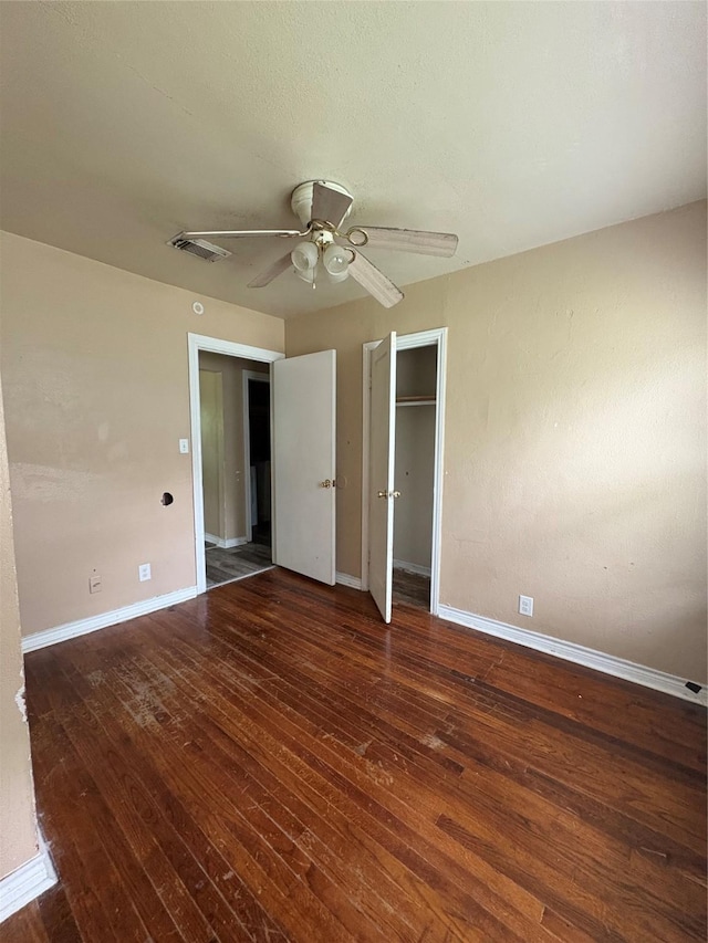 1206 11th St N, Texas City, TX 77590 - unfurnished bedroom featuring hardwood / wood-style flooring, ceiling fan, and a closet