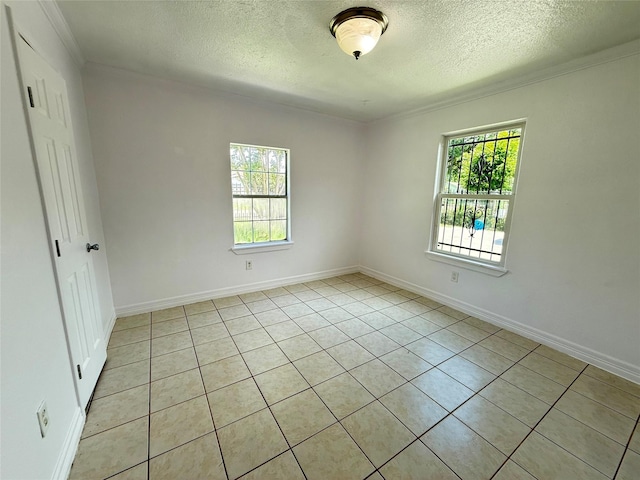 5701 Luna St, Houston, TX 77076 - unfurnished room with a textured ceiling, ornamental molding, and light tile patterned flooring