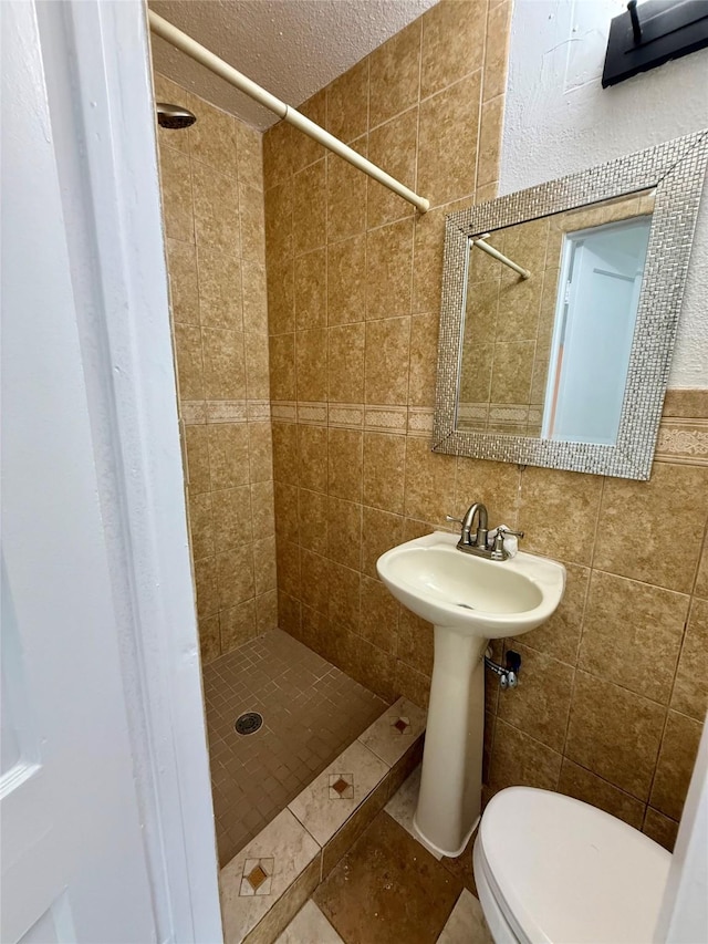 5701 Luna St, Houston, TX 77076 - full bath with a shower stall, tile patterned floors, and a textured ceiling