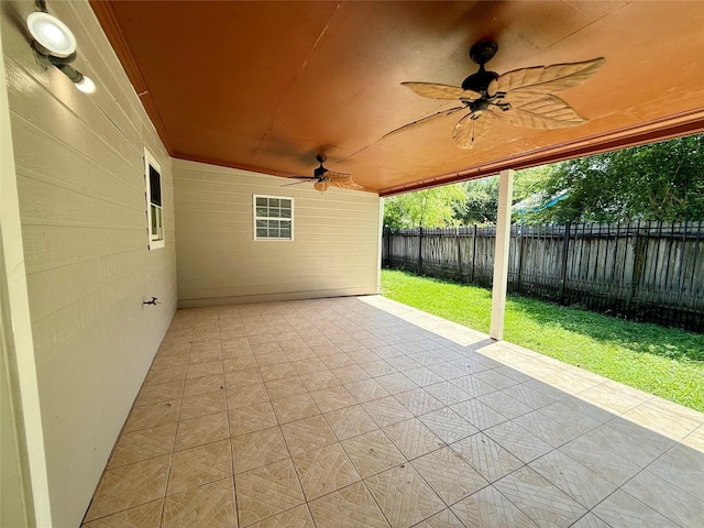 5701 Luna St, Houston, TX 77076 - fenced backyard with ceiling fan and a patio area