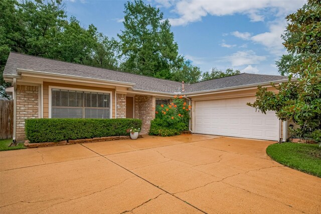 3031 The Highlands Dr, Sugar Land, TX 77478 - ranch-style home featuring brick siding, a garage, driveway, and a shingled roof