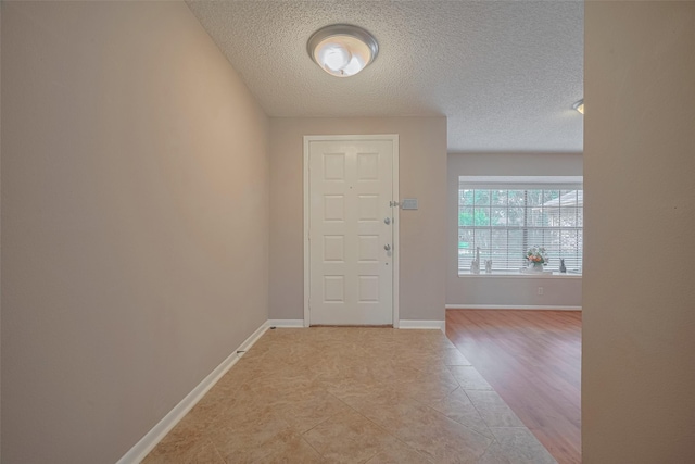 3031 The Highlands Dr, Sugar Land, TX 77478 - foyer entrance featuring a textured ceiling and light tile patterned flooring