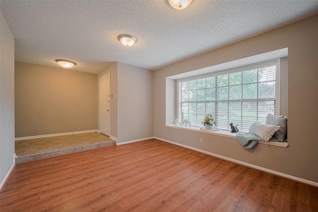3031 The Highlands Dr, Sugar Land, TX 77478 - unfurnished room with wood finished floors and a textured ceiling
