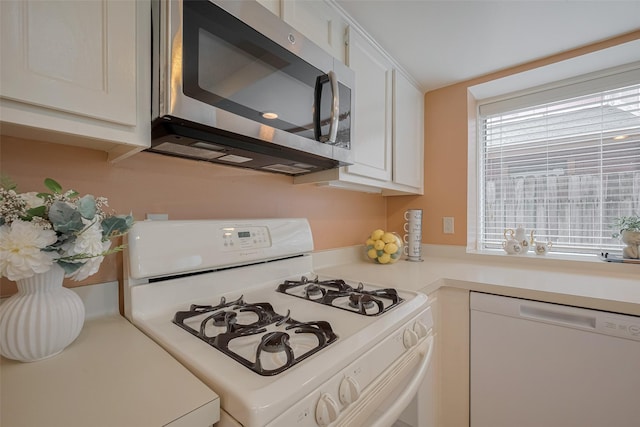 3031 The Highlands Dr, Sugar Land, TX 77478 - kitchen with white appliances, light countertops, and white cabinets