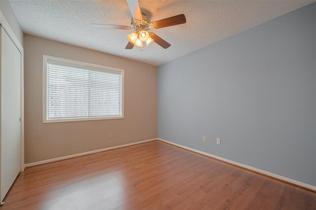 3031 The Highlands Dr, Sugar Land, TX 77478 - unfurnished room featuring light wood-style floors, a ceiling fan, and a textured ceiling