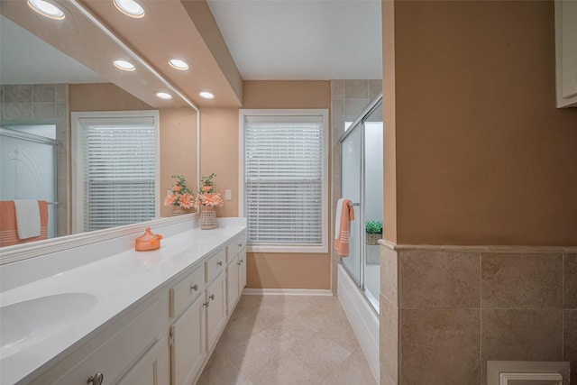 3031 The Highlands Dr, Sugar Land, TX 77478 - full bath with recessed lighting, vanity, tile walls, tile patterned floors, and enclosed tub / shower combo