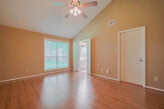 3031 The Highlands Dr, Sugar Land, TX 77478 - empty room featuring a ceiling fan, wood finished floors, and high vaulted ceiling