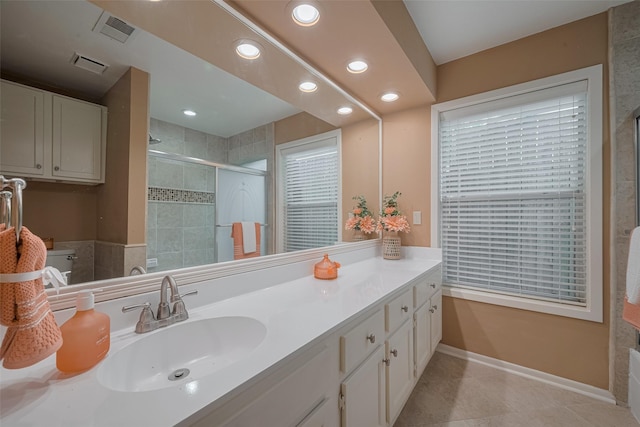 3031 The Highlands Dr, Sugar Land, TX 77478 - bathroom with recessed lighting, vanity, a shower stall, and tile patterned floors