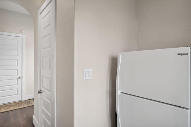 1746 Du Barry Ln, Houston, TX 77018 - kitchen featuring freestanding refrigerator, dark wood-type flooring, and arched walkways