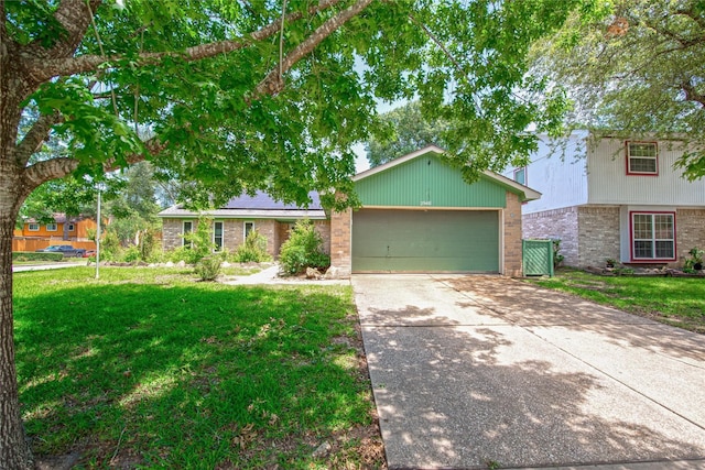 25418 Sugar Valley Ln, Spring, TX 77373 - view of front of house featuring brick siding, concrete driveway, an attached garage, and a front yard