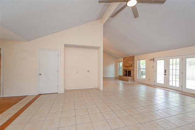 25418 Sugar Valley Ln, Spring, TX 77373 - unfurnished living room with a ceiling fan, beamed ceiling, a textured ceiling, light tile patterned flooring, and a brick fireplace